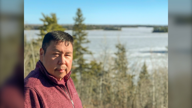 Gerald Lewis, chief of Iskatewizaagegan 39, also known as Shoal Lake 39, in northwestern Ontario, is seen on Thursday, March 25, 2021, beside the lake that is Winnipeg's sole source of drinking water. The community is in a legal dispute with Ontario and Winnipeg over the city's water-taking. THE CANADIAN PRESS/Handout