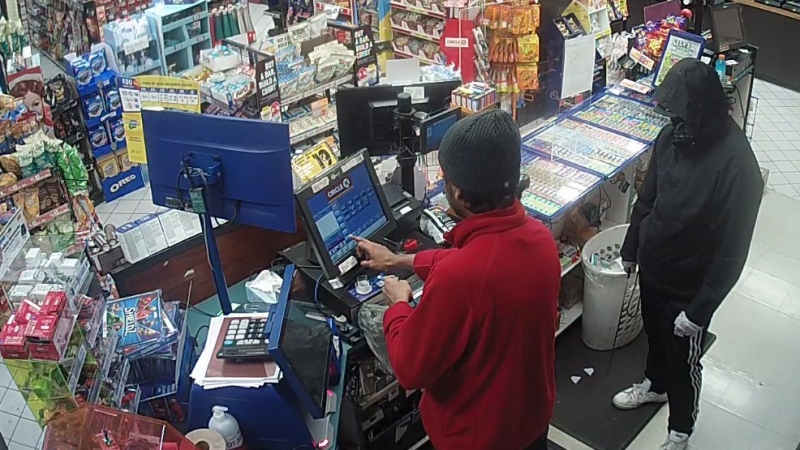 Security video captures a suspect accused of armed robbery at the Circle K convenience store on St. Vincent Street in Barrie, Ont. on April 1, 2021 (Barrie Police Services)