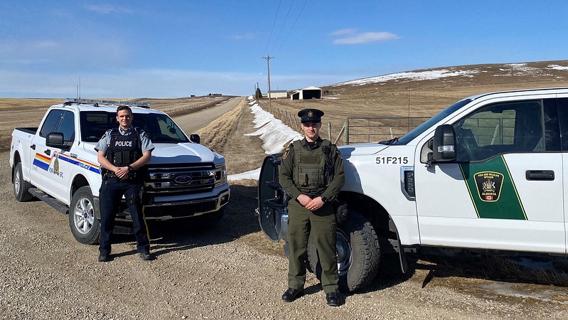 RCMP Const. Nick Wyczynski of the RCMP’s Airdrie integrated rural detachment with fish and wildlife officer Matt Michaud (Supplied).
