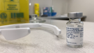 A vial of COVID-19 vaccine sits on a desk at a pharmacy in Ottawa. April 3, 2021. (Jeremie Charron / CTV News Ottawa)