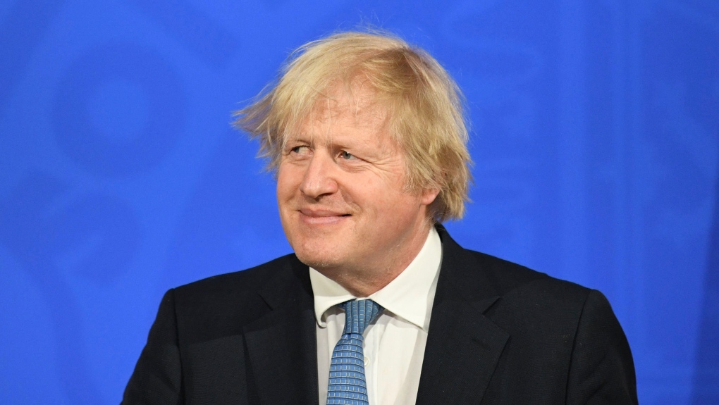 Britain's Prime Minister Boris Johnson pauses, dur