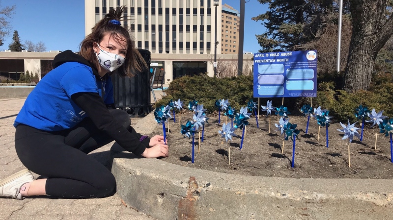 Sarah Labadie and her organization Holding Hope are installing 763 blue pinwheels in front of Regina city hall to raise awareness about child abuse prevention this April. (Stefanie Davis / CTV News Regina) 