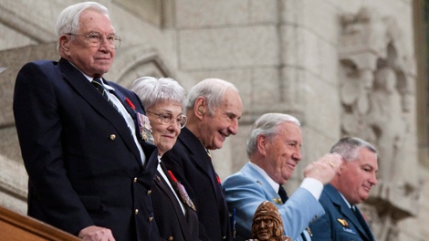 Second World War veterans Gerry Bowen, left to right, and Helen Rapp are joined by Second World War and Korean war veteran Lloyd Swick, peacekeeping veteran Ray Paquette, and currently serving member of the military Leo Phillips as they are acknowledged by the House of Commons following question period in the on Parliament Hill in Ottawa, Ont., Thursday Nov. 5, 2009. (Sean Kilpatrick  / THE CANADIAN PRESS)