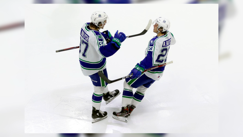 Brothers Kaleb and Aiden Bulych celebrate a goal with the Swift Current Broncos, the two are embracing the opportunity as teammates (Courtesy: Keith Hershmiller)