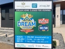 A sign explain some of the rules for the Dream Home Lottery in London, Ont. is seen Thursday, April 8, 2021. (Jim Knight / CTV News)