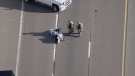 A motorcycle is seen on Highway 427 near Eglinton Avenue after a crash on April 9, 2021. (CTV News Toronto)