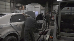 Auto body technicians work on vehicles at Vernaus Auto Body in Winnipeg on Apr.9, 2021. (Source: Josh Crabb/ CTV News Winnipeg)