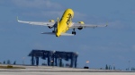 A Spirit Airlines Airbus A320 takes off from Fort Lauderdale-Hollywood International Airport, Tuesday, Jan. 19, 2021, in Fort Lauderdale, Fla. (AP Photo/Wilfredo Lee)