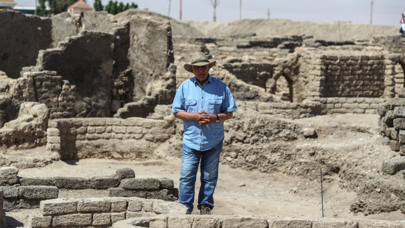 Zahi Hawass talks to media in a 3,000-year-old lost city in Luxor province, Egypt, Saturday, April 10, 2021. The newly unearthed city is located between the temple of King Rameses III and the colossi of Amenhotep III on the west bank of the Nile in Luxor. The city continued to be used by Amenhotep III's grandson Tutankhamun, and then his successor King Ay. (AP Photo/Mohamed Elshahed)