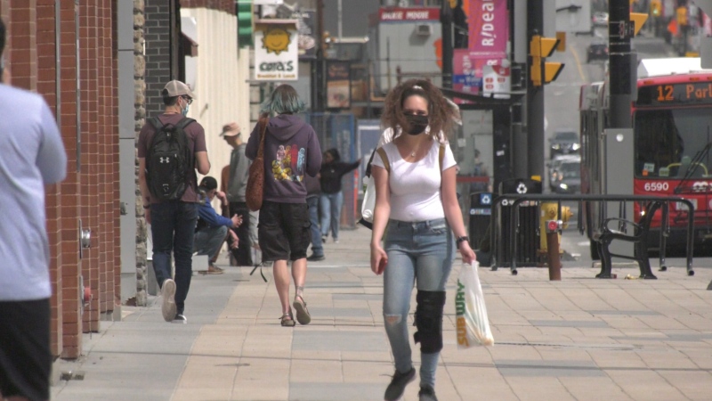 People walk down the street during the COVID-19 pandemic in Ottawa, Ont. on April 11, 2021. (Colton Praill / CTV News Ottawa)