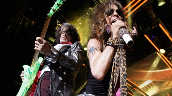 Vocalist Steven Tyler, right, and lead guitarist Joe Perry of the rock band Aerosmith perform at the Verizon Wireless Amphitheatre in Maryland Heights, Mo., on Wednesday, June 10, 2009. (AP / Jeff Roberson)