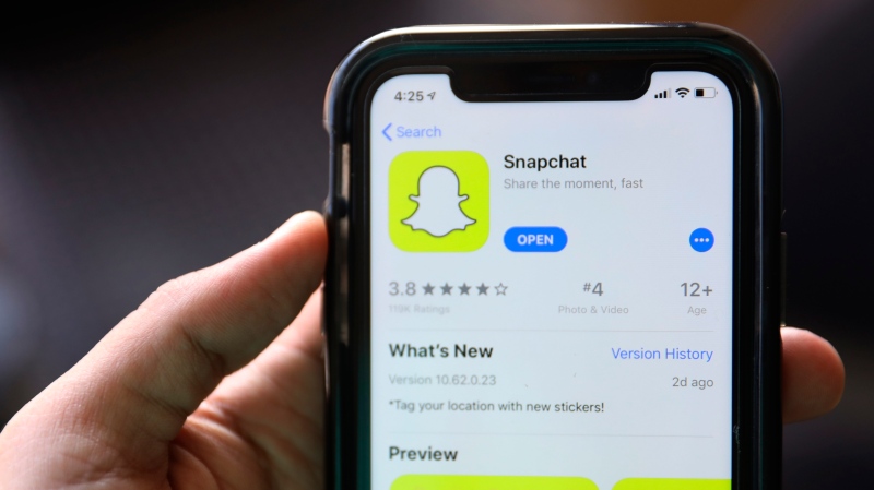 This July 30, 2019, file photo shows an introduction page for Snapchat shown in a mobile phone displayed at Apple's App Store in Chicago. (AP Photo/Amr Alfiky, File)
