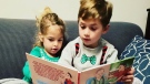 Children reading 'Tony's New Friend'.