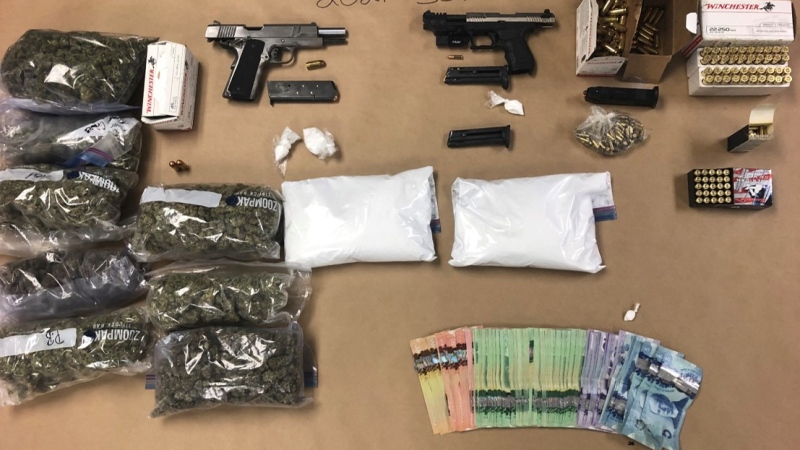 According to police, officers seized guns, ammunition, cannabis, cocaine, codeine and about $3,880 in cash from a Saskatoon home. (Saskatoon Police Service)