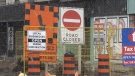 Construction signs on Dundas Street in London, Ont. are seen on Tuesday, April 20, 2021. (Jordyn Read / CTV News)