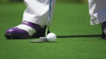 A golfer lines up a putt in this file photo. (Tyler Hendy / Pexels)