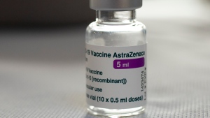 A vial of AstraZeneca vaccine against COVID-19 sits on a general practitioner's table during a vaccination campaign in Amsterdam, Netherlands, Wednesday, April 14, 2021. (AP Photo/Peter Dejong