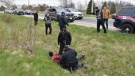 Police are seen arresting a man across the highway from the Church of God Restoration in Aylmer, Ont. on Sunday, April 26, 2021. (Source: Brett Hueston / Aylmer Express)