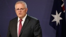 Australia's Prime Minister Scott Morrison comments at a press conference in Sydney, Australia, on April 27, 2021. (Rick Rycroft / AP)