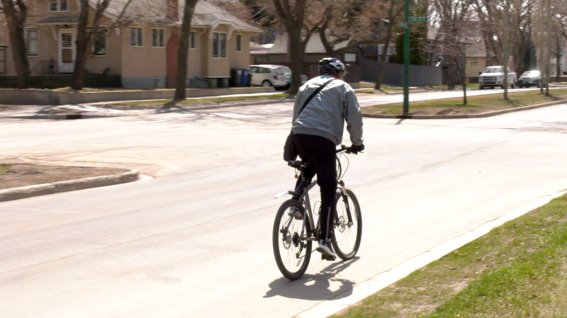 A cyclist rides along Victoria Avenue in Saskatoon. (Daniel Shingoose/CTV Saskatoon)