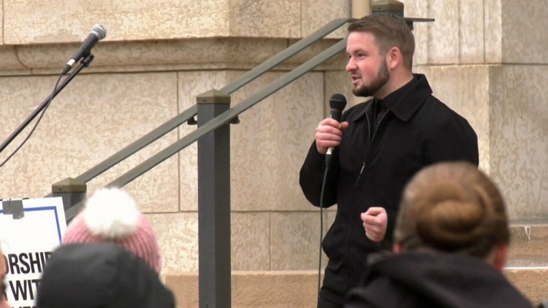Tobias Tissen, a minister at the Church of God Restoration near Steinbach, Man., speaks at a rally outside Manitoba's Court of Queen's Bench in Winnipeg on Monday, May 3, 2021. (Source: CTV News Winnipeg)