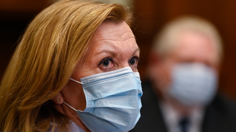 Ontario Health Minister Christine Elliott listens as Ontario Premier Doug Ford gives an update regarding the Ontario COVID-19 vaccine during the COVID-19 pandemic in Toronto on Tuesday, January 5, 2021. THE CANADIAN PRESS/Nathan Denette