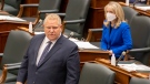 Ontario Social Services Minister Merrilee Fullerton listens as Premier Doug Ford answers questions on Wednesday, May 5, 2021. THE CANADIAN PRESS/Frank Gunn