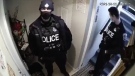 A Hamilton police officer who allegedly lunged at a woman while responding to a reported dispute between a landlord and their tenant is shown in this image taken from a video posted to social media. (Twitter)