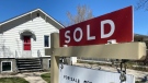 A for sale sign is displayed in front of a house in this file photo. (Cole Davenport/CTV Regina)