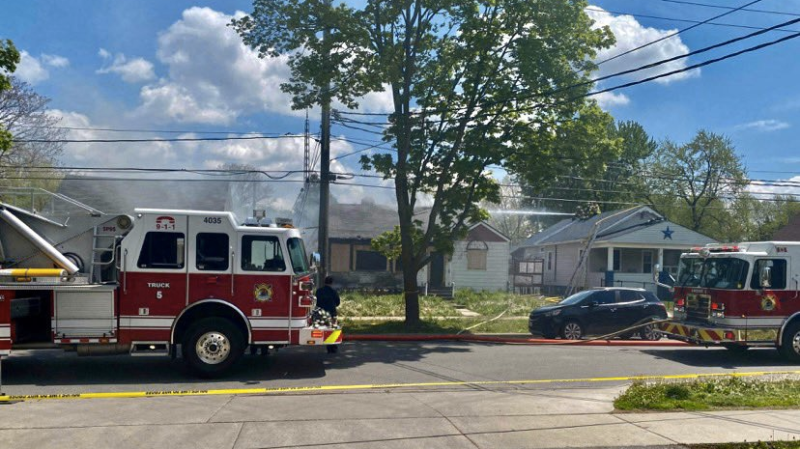 Fire crews responded to a house and garage fire in the 3500 block of Peter Street in Windsor, Ont. on Friday, May 7, 2021. (OnLocation/Twitter)