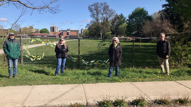 Members of the Oxford Park Community Association stand where a school bus thoroughfare is expected to spill out into their neighbourhood on May 10, 2021. (Sean Irvine/CTV News)