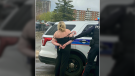 An image showing the arrest of a woman accused of assaulting an Ottawa mother with bear spray before allegedly abducting an 8-day-old infant on Mother's Day, May 9, 2021. (Facebook)
