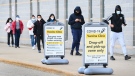People line up at a mass vaccination centre during the COVID-19 pandemic in Mississauga, Ont., on Monday, May 10, 2021. THE CANADIAN PRESS/Nathan Denette
