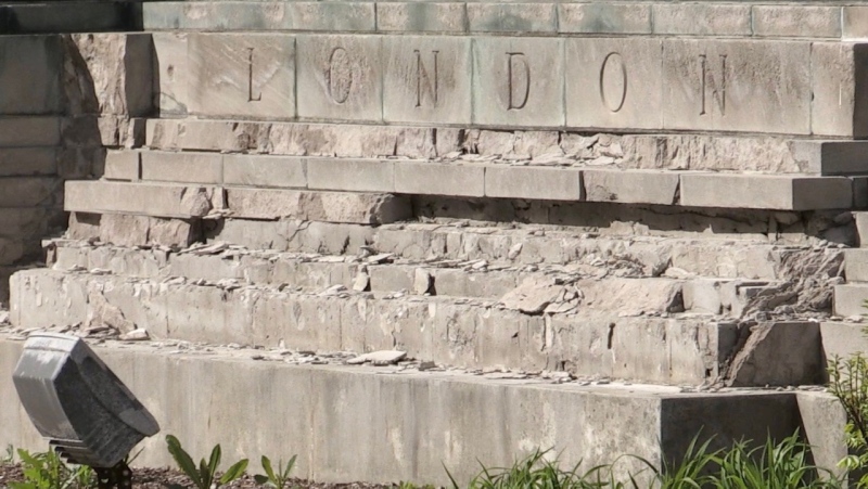 The crumbling base of the 'People and the City' monument on Wellington Street, just north of Queens Avenue, in London, Ont. is seen on Tuesday, May 11, 2021. (Sean Irvine / CTV News)