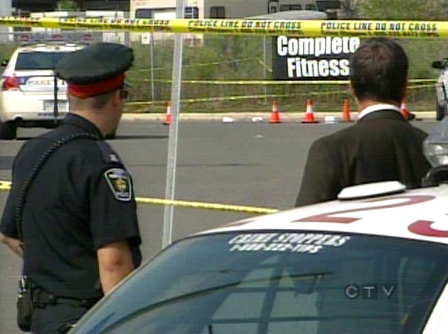 York Regional Police investigate the scene at Complete Fitness in Newmarket, Ont. on Wednesday, Aug. 29, 2007.