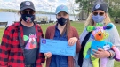 Mind-Aid is presented with a cheque from the Coco Bear organization that raises money for addiction and mental health. Pictured are Jean-Marc Dubois (left), Jody North and Shari Dubois. (KC Colby/CTV)