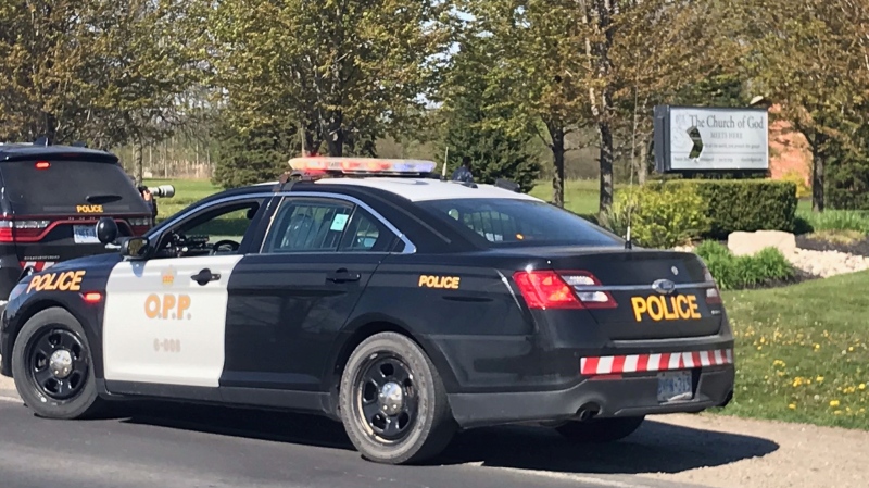 Ontario Provincial Police work at the Church of God Restoration in Aylmer, Ont. on Friday, May 14, 2021. (Sean Irvine / CTV News)