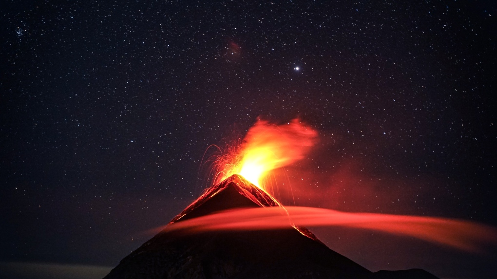 A volcano erupts