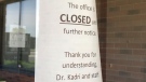 Signs on the door of Kadri’s Kidney Care clinic indicate the office is currently closed indefinitely. (Michelle Maluske)