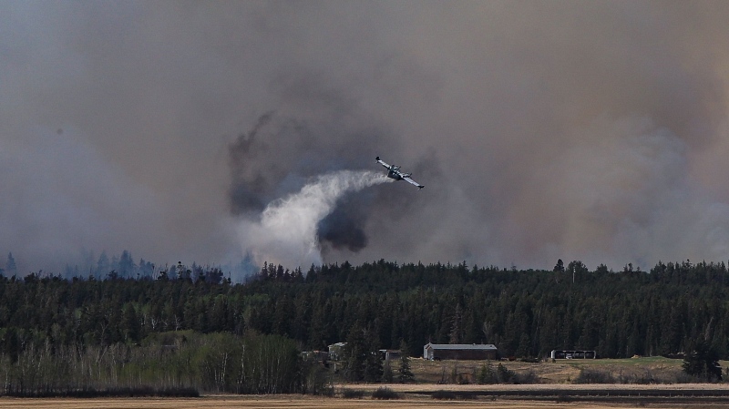 A water bomber works to contain a blaze near Prince Albert. (Courtesy Mike Horn)