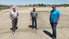 Rob Myers (left), Don Tetrault (Center) and Mike Vagi (right) stand on the 82–acre property they just bought to redevelop the site where the former Navistar truck plant used to be in Chatham, Ont. on Tuesday, May 18, 2021. (Michelle Maluske/CTV Windsor)