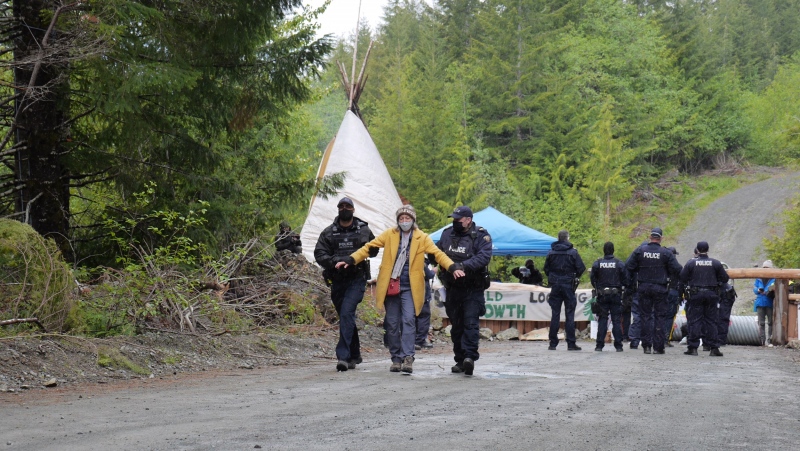 Police arrest anti-old-growth logging protesters who refuse to leave a restricted access area set up by RCMP near Port Renfrew, Vancouver Island: May 18, 2021 (CTV News)
