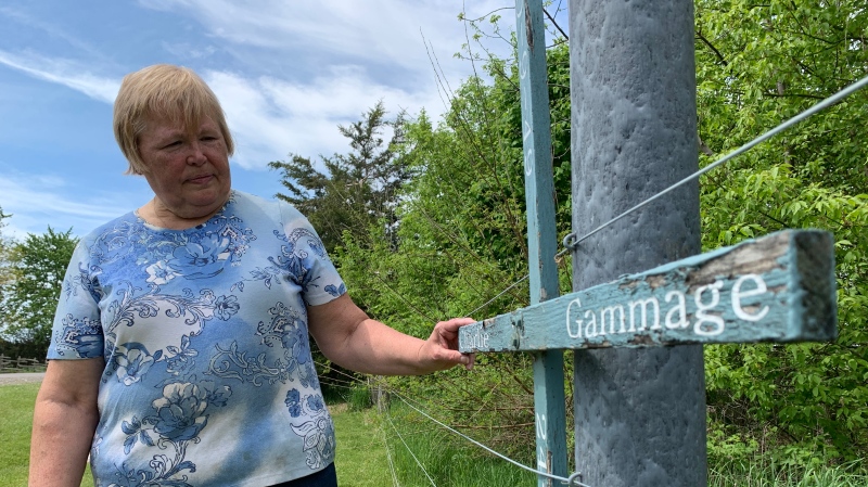 Joan Gammage-Cofell stands beside her brother Charlie’s roadside memorial near Ridgetown, Ont. on Wednesday, May 19, 2021. (Chris Campbell/CTV Windsor)