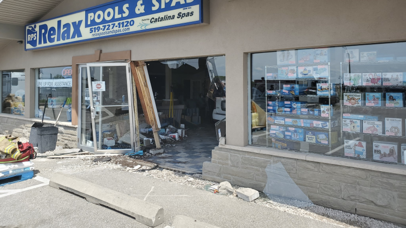A vehicle crashed into a storefront on Patillo Road in Lakeshore, Ont. on Thursday, May 20, 2021. (courtesy OPP)