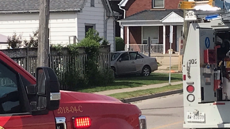 A light brown car has struck a home and impacted gas meter in London, Ont. on Friday, May 21, 2021. (Sean Irvine/ CTV News)