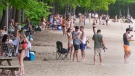 In this file photo, people enjoy the warm weather at the beach in Oka Provincial Park Thursday, May 20, 2021 in Oka, Quebec. THE CANADIAN PRESS/Ryan Remiorz