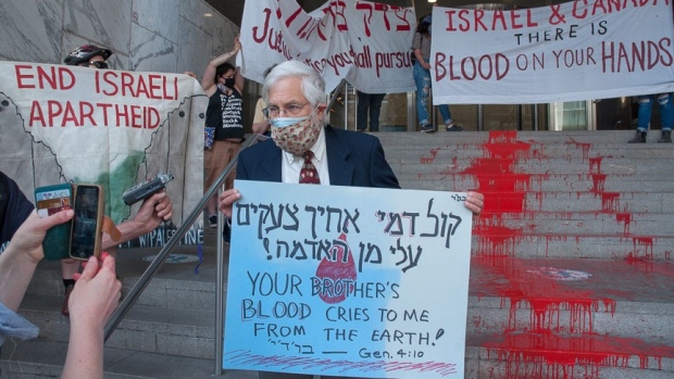 Toronto activists paint Israeli consulate steps with 'river of blood' after more than 200 Palestinians killed, 66 children