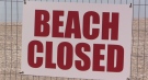 A 'Beach Closed' sign is seen in Goderich, Ont. on Friday, May 21, 2021. (Scott Miller / CTV News)