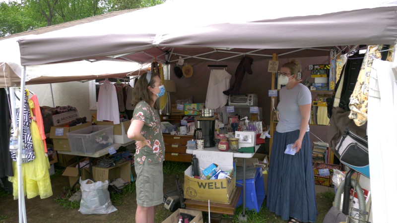 Kate Stacey (left) and Jennifer Tanner talking about the community engagement they've seen over the past few weeks at Tanner's 'Take and Give Tent'. (Nate Vandermeer / CTV News Ottawa)
