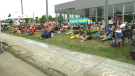 Residents of Vanier turn out to protest a proposed $2.9 million tax break for a planned Porsche dealership at this site on Montreal Road in Ottawa. May 25, 2021. (Shaun Vardon / CTV News Ottawa)